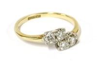 Lot 35 - A four stone diamond crossover ring