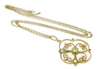 Lot 116 - An Edwardian gold peridot and split pearl open pendant