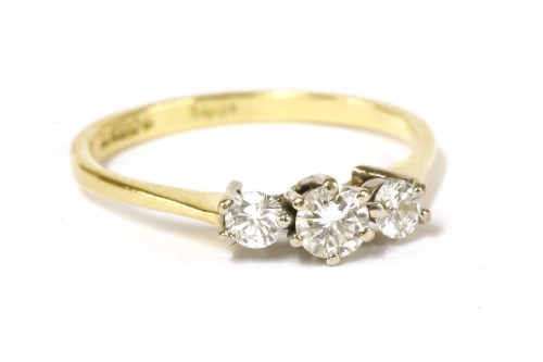 Lot 69 - An 18ct gold three stone diamond ring