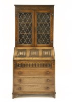 Lot 635 - A Maple & Co oak bureau bookcase