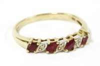Lot 54 - A 9ct gold marquise cut ruby and diamond half eternity ring