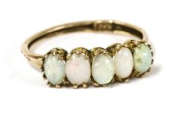 Lot 10 - A gold five stone opal cabochon ring