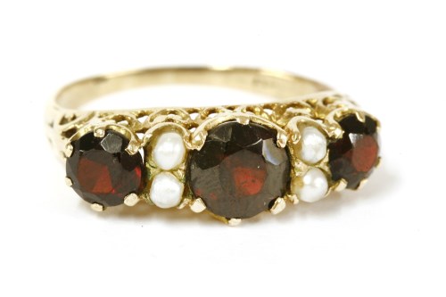 Lot 53 - A gold graduated garnet and split pearl ring