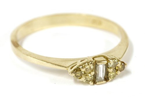 Lot 55 - A gold baguette and treated yellow diamond trefoil cluster ring