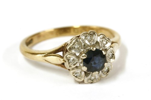 Lot 30 - A 9ct gold sapphire and diamond cluster ring
