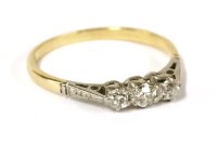 Lot 29 - A gold three stone diamond ring