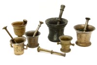 Lot 375 - A collection of six bronze and brass pestle and mortars