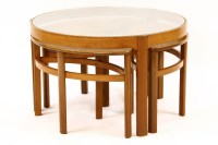 Lot 693 - A 1960's teak combination coffee table and nest of tables