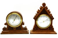 Lot 505 - A desktop aneroid barometer in a carved oak case