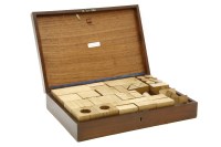Lot 294 - A mahogany cased set of architects oak building blocks and plans