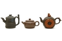 Lot 236 - Three Chinese Yixing type tea pots and covers