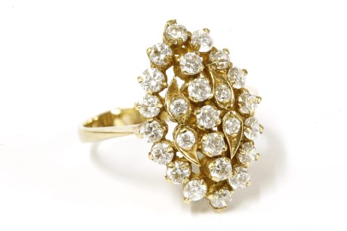 Lot 20 - A gold diamond simulant lozenge shaped cluster ring