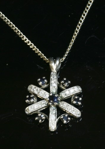 Lot 9 - A sapphire and diamond cluster pendant