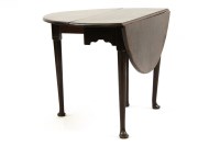 Lot 518 - A George II mahogany drop flap table