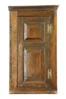 Lot 484 - A early 18th century oak corner cupboard