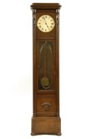 Lot 454 - An oak longcase clock
