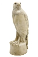 Lot 263 - A carved marble figure of an eagle perched on a rock