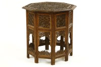 Lot 459 - A carved Indian hardwood folding table