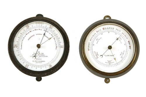 Lot 232 - A zinc cased 'fisherman's aneroid barometer'