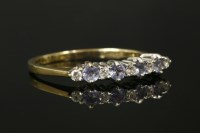 Lot 5 - A 9ct gold tanzanite and diamond nine stone ring