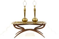 Lot 307 - A pair of Persian style brass table lamps
