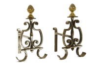 Lot 489 - A pair of wrought iron and brass fire dogs