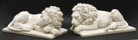 Lot 300 - A pair of reconstituted marble lions after Canova