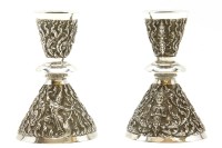 Lot 143 - A pair of Thai silver candlesticks