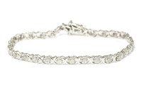 Lot 35 - A 9ct white gold illusion set  brilliant cut diamond line bracelet