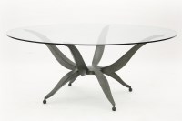 Lot 549 - A Villiers Brothers steel and glass topped circular dining table