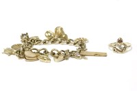 Lot 36 - A gold charm bracelet with 9ct gold padlock and eleven assorted charms