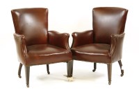 Lot 423 - A pair of red leather armchairs