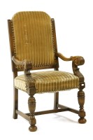 Lot 412 - A 19th century carved oak armchair