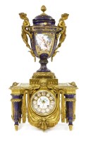 Lot 442 - A French gilt metal and porcelain mantel clock
