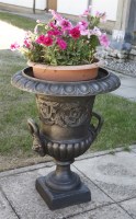 Lot 541 - A pair of cast iron campana urns