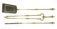 Lot 543 - A set of brass and steel fire tools