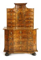 Lot 546 - A German walnut serpentine-fronted side cabinet