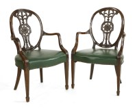 Lot 555 - A pair of Adam-style mahogany elbow chairs