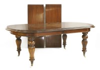 Lot 556 - A Victorian style mahogany wind-out dining table