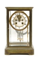 Lot 287 - A French brass four glass mantel clock