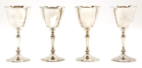 Lot 123 - Four 20th century silver goblets on turned knop stems and circular spreading feet