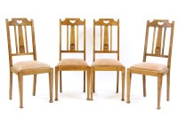 Lot 407 - A set of four Arts and Crafts oak dining chairs