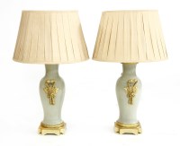 Lot 491 - A pair of gilt metal mounted celadon style table lamps