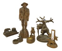 Lot 199 - A Black Forest softwood figure of a man playing a bagpipe