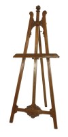 Lot 559 - A walnut easel