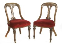 Lot 589 - A pair of mahogany serpentine fronted side chairs