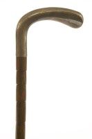Lot 244 - A collapsible partridge-wood cane