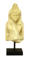 Lot 290 - An Egyptian limestone figure of a goddess