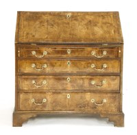 Lot 523 - A George II walnut bureau