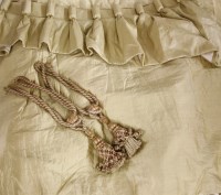 Lot 235 - A pair of golden silk lined curtains
